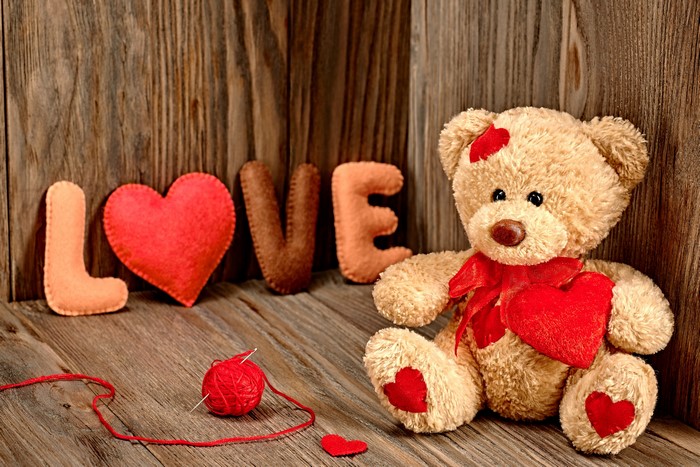 Teddy bear with LOVE letters and hearts