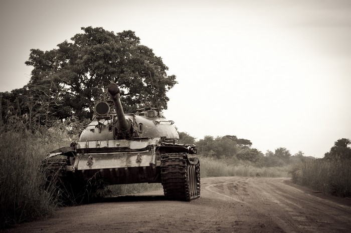 Abandoned tank on a dirt road