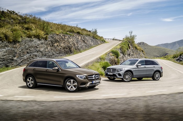 Two Mercedes-Benz GLC SUVs on a winding road