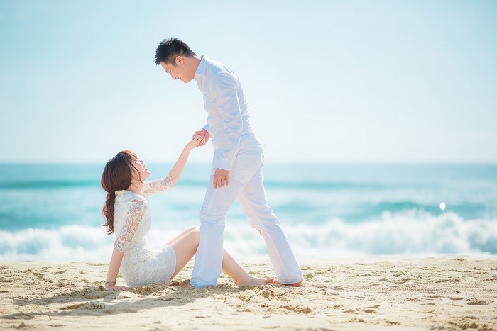 Couple holding hands on a beach