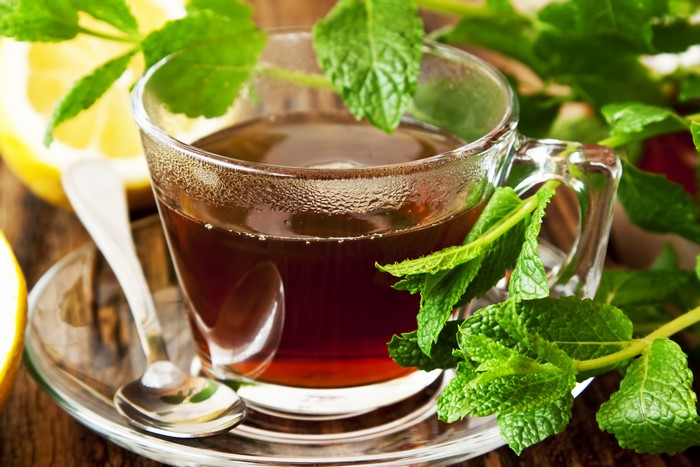 Cup of tea with mint and lemon