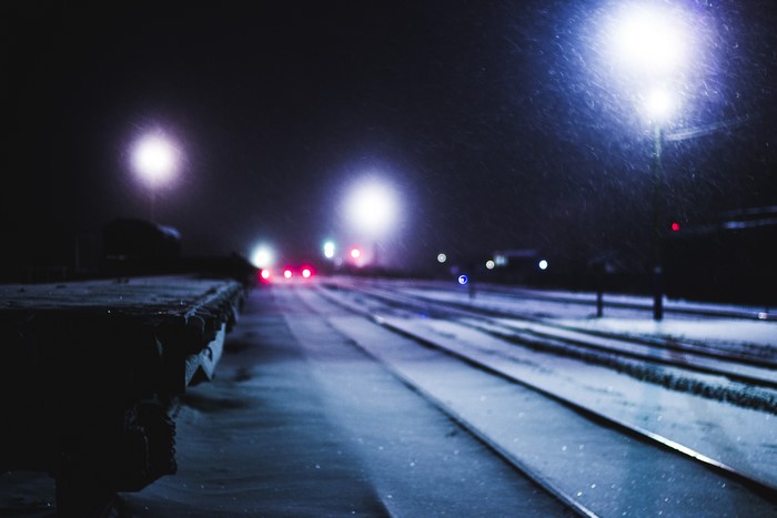 Railroads at night in winter with street lights