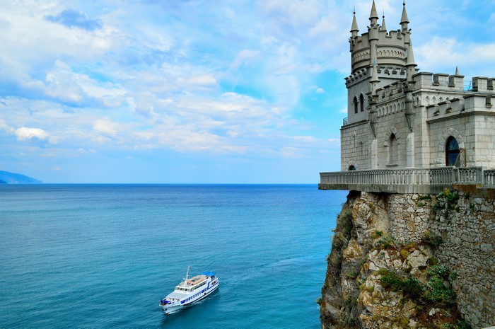 Swallow's Nest Castle on Cliff Overlooking Sea with Boat