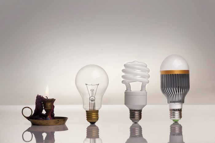 Evolution of Lighting: Candle, Incandescent, CFL, and LED bulbs
