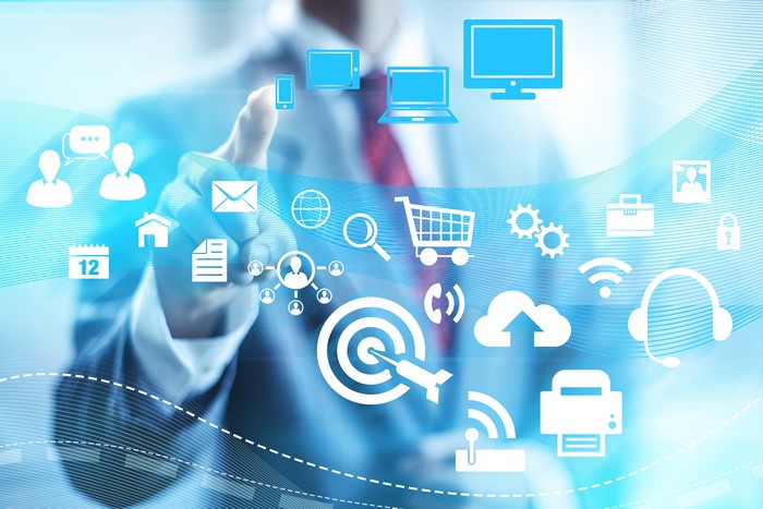 Man touching screen with technology icons