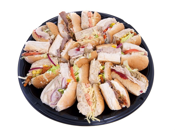 Assortment of sandwiches on a black platter