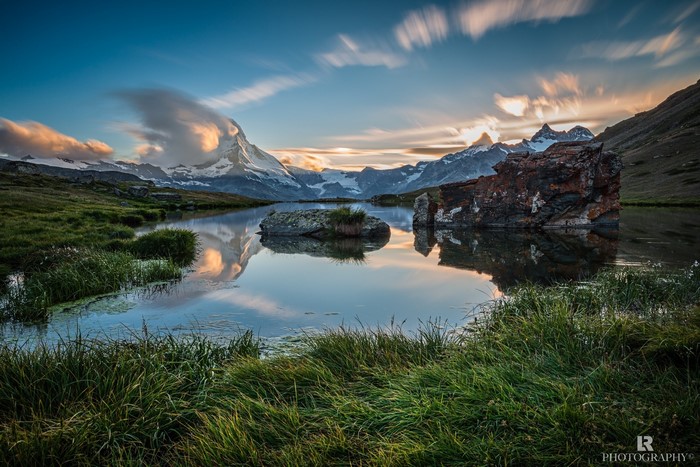 Matterhorn reflected in a mountain lake at sunset