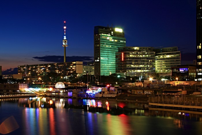 Vienna skyline at night with Danube river and TV tower