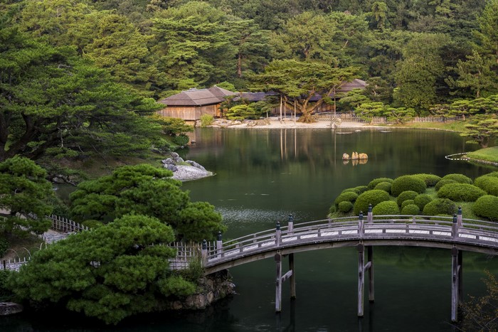 Ritsurin Garden in Takamatsu, Japan with a bridge and pond