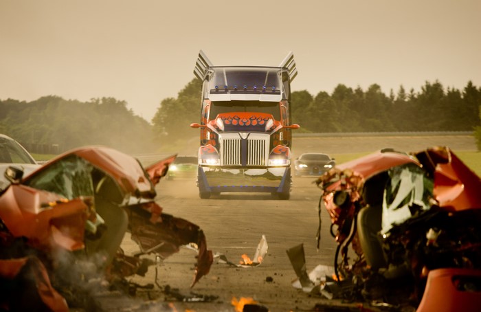 Optimus Prime truck and wrecked cars on a road