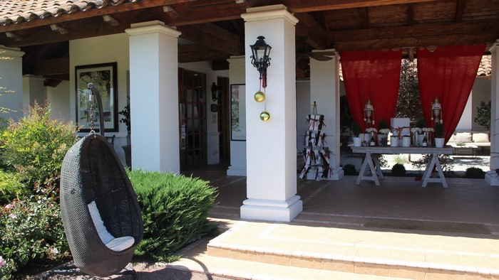 Outdoor patio with hanging chair and Christmas decorations