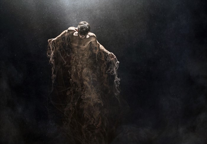Man emerging from smoke