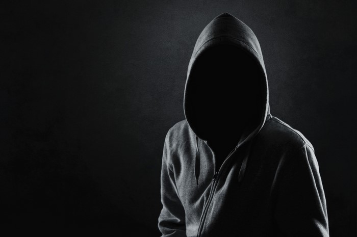 Person wearing a hooded sweatshirt