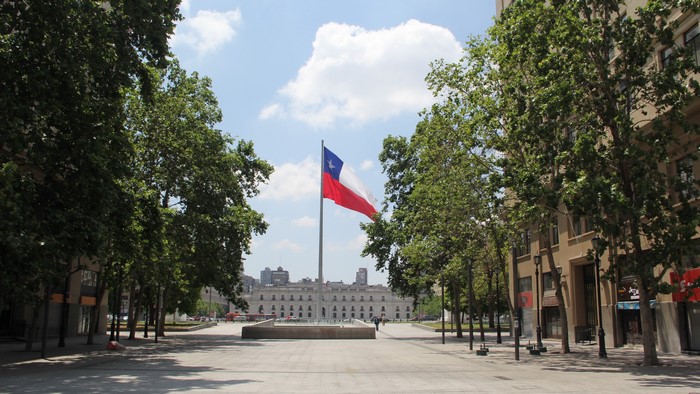 Chilean flag in front of La Moneda Palace, Santiago