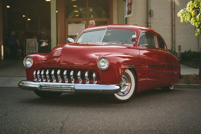 Red Mercury car parked on a street