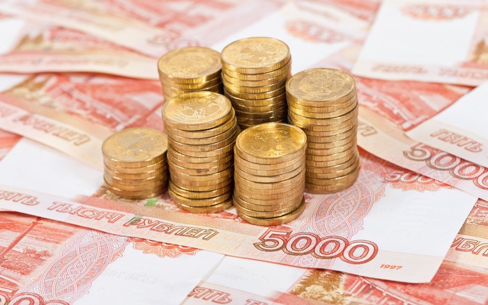 Stacks of Russian Ruble Coins on Banknotes