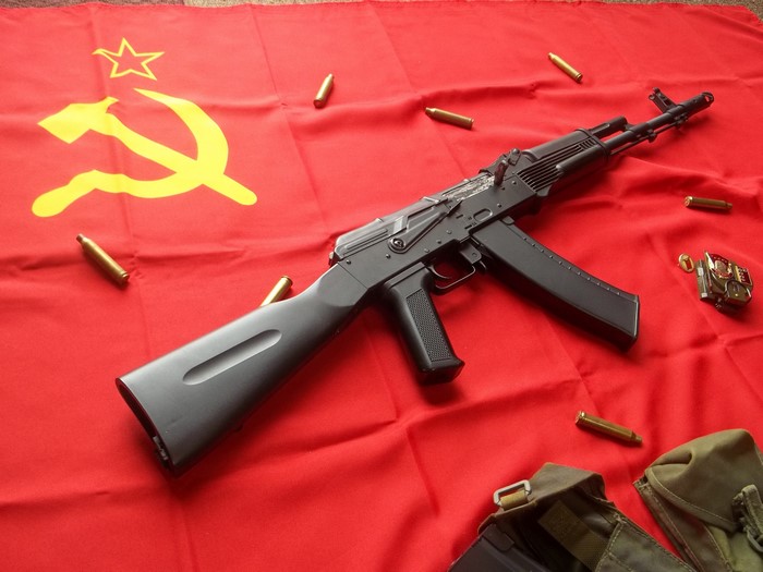Assault rifle on USSR flag with ammunition