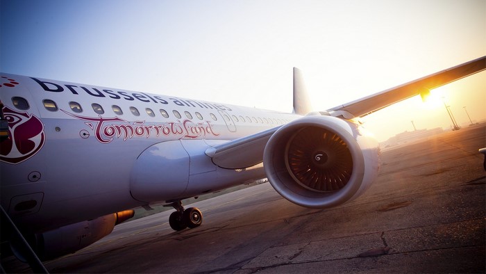 Brussels Airlines Tomorrowland airplane on tarmac at sunset