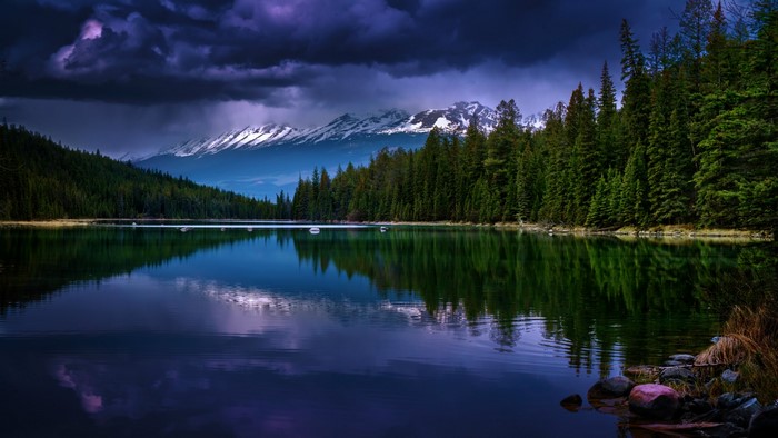Lake with Forest and Snow-Capped Mountains