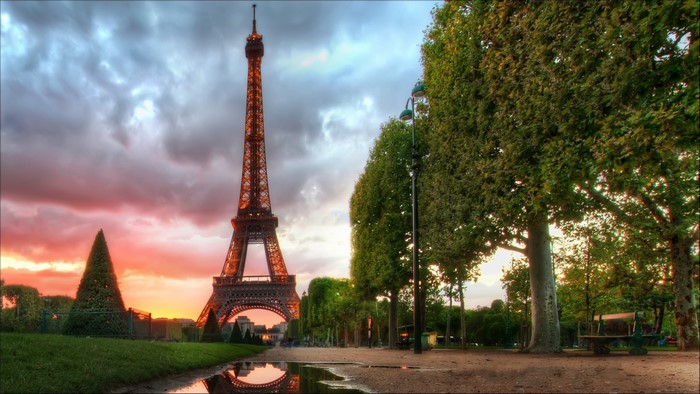 Eiffel Tower in Paris at sunset with trees