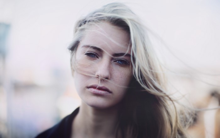 Blonde girl with hair blowing in the wind