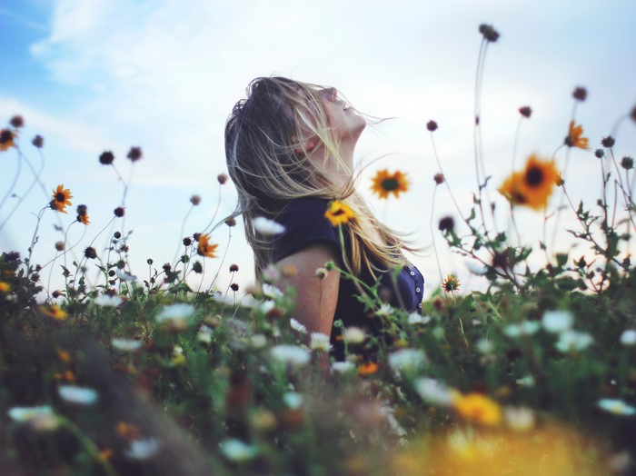 Woman in a field of flowers