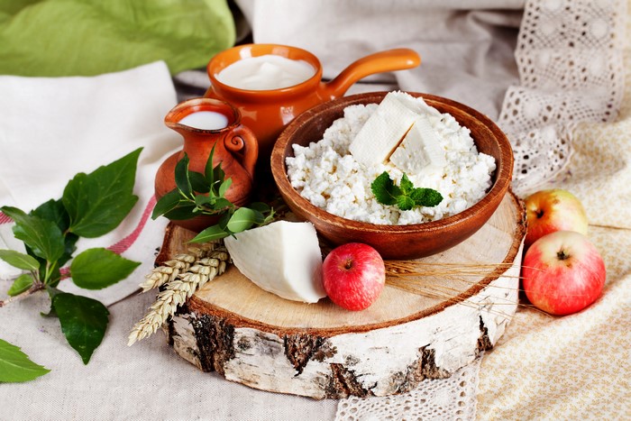 Still-life of cheese, milk, and apples