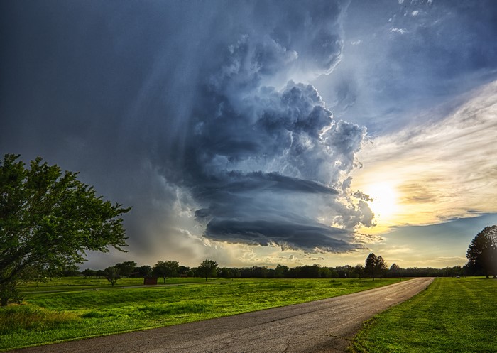 Stormy Sky Over Fields and Road