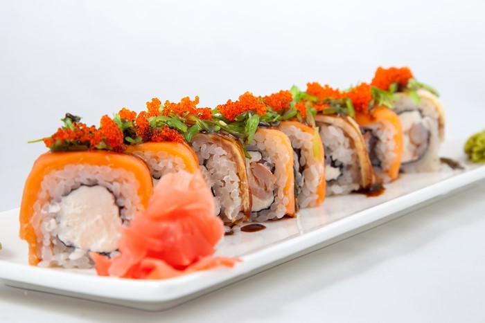 Sushi rolls with salmon and roe on a plate