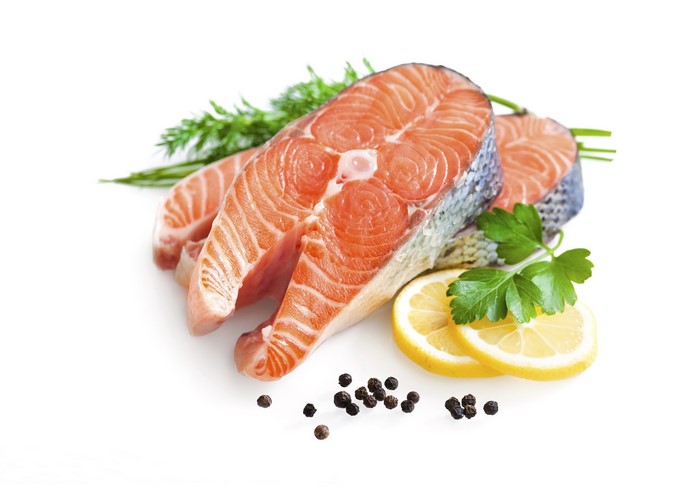 Salmon steaks with lemon, parsley, and peppercorns