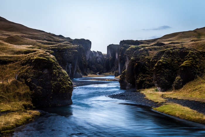River flowing through a mossy canyon