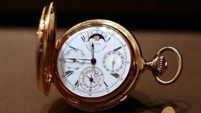Gold pocket watch with multiple dials