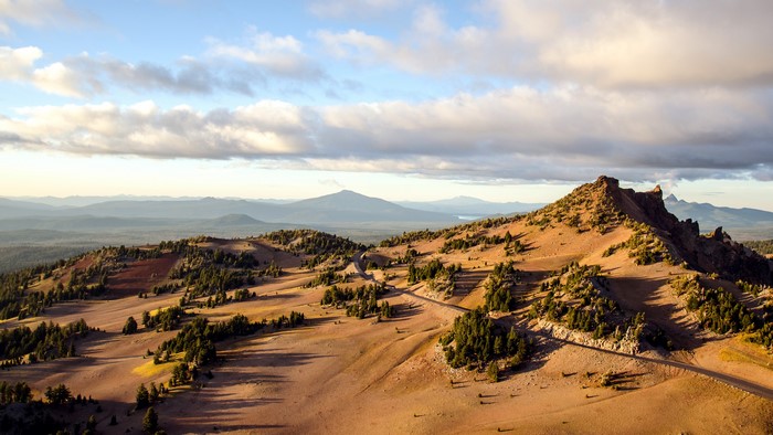 Mountain landscape with road and clouds