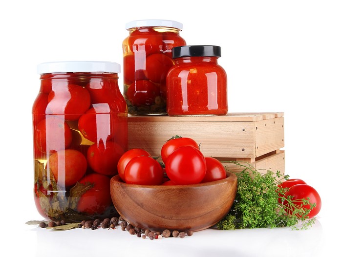 Jars of Pickled Tomatoes with Dill and Spices