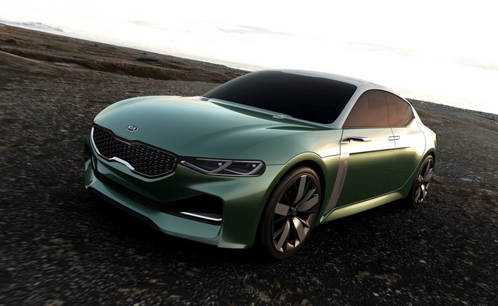 Green Kia Novo concept car on rocky terrain