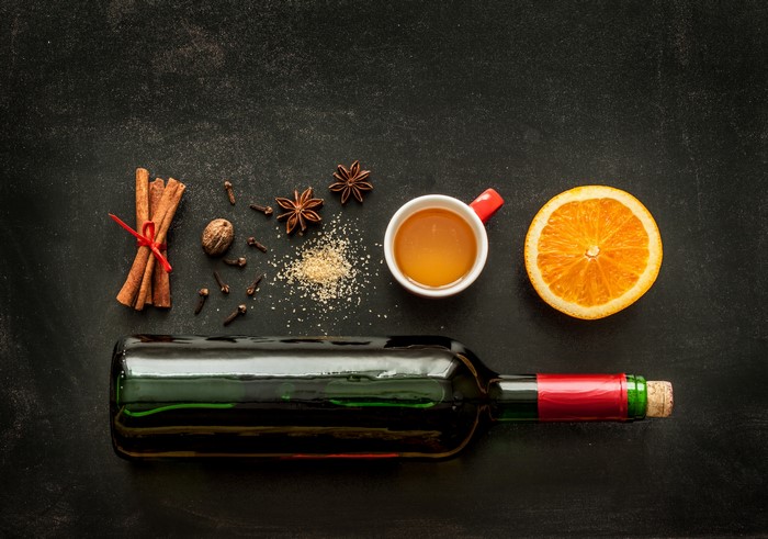 Wine bottle with spices and orange slice