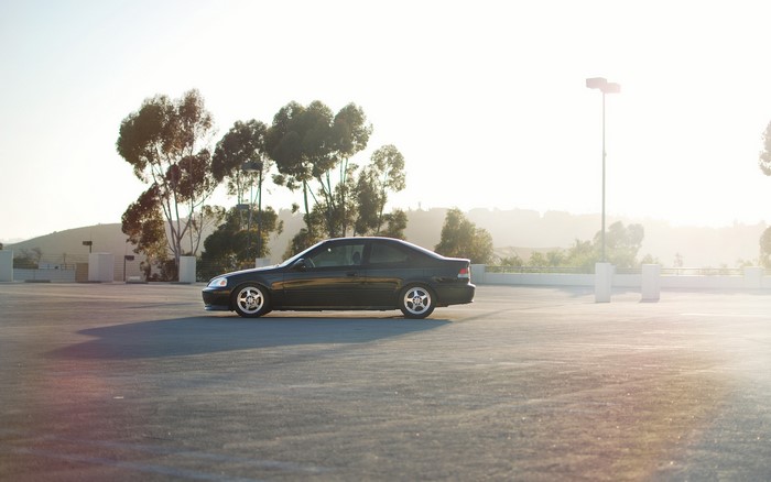 Black Honda Civic parked in a parking lot