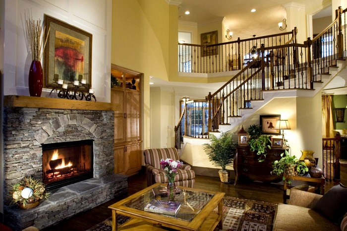 Living room with fireplace and grand staircase