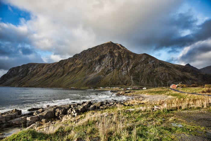 Mountain Coastline with Village and Red House