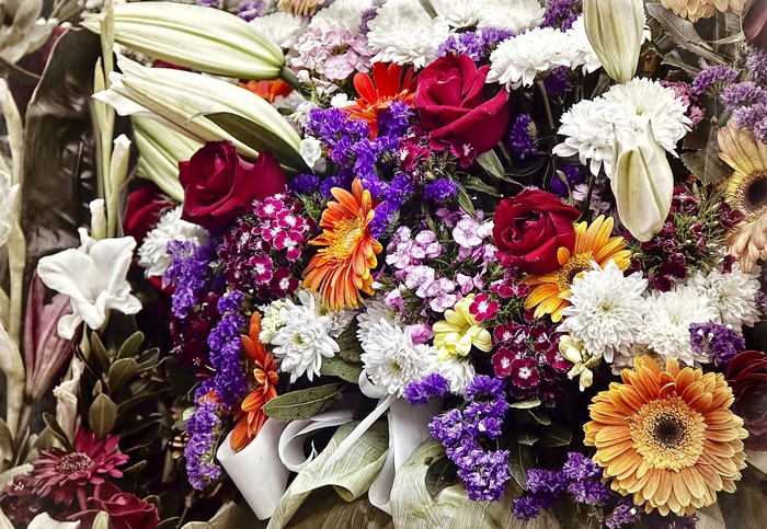 A vibrant bouquet of Roses, Gerberas, and Lilies