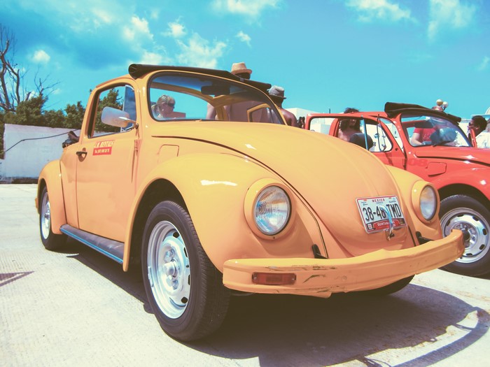 Orange Volkswagen Beetle with Red Beetle