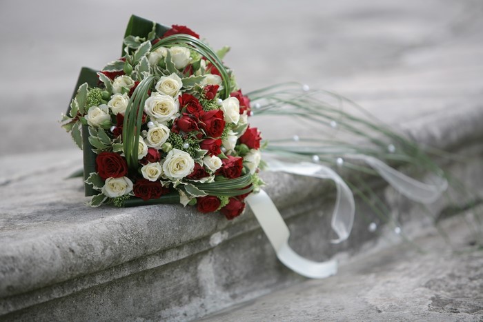 Red and white rose bouquet with ribbon