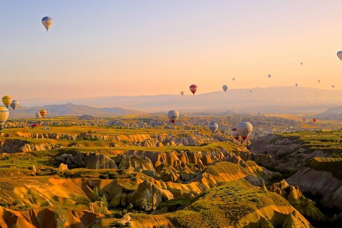 Hot air balloons over Cappadocia at sunrise