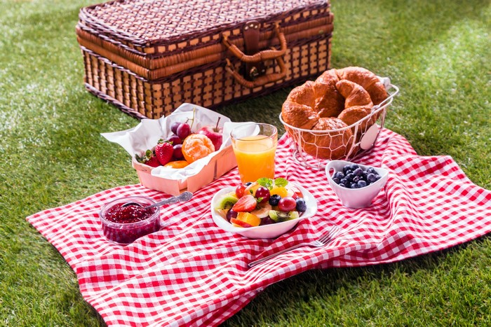 Picnic with Croissants, Fruit Salad, Juice, and Jam