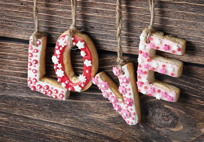 Love cookies decorated with icing and sprinkles