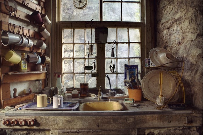 Rustic kitchen sink and window with dishes