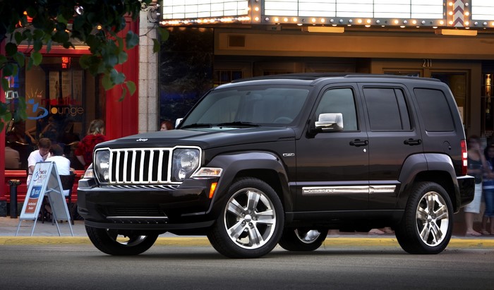 Black 2011 Jeep Liberty parked outside a lounge