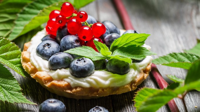 Forest cupcake with blueberries and currants