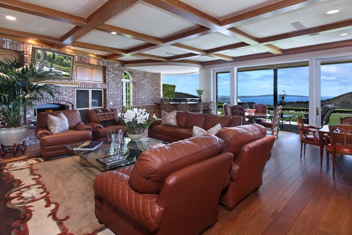 Living room with leather sofas and ocean view
