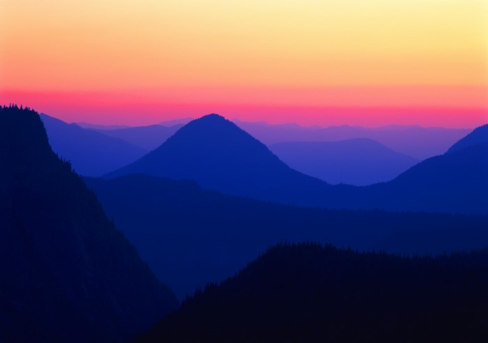Mountain range at sunset with vibrant sky
